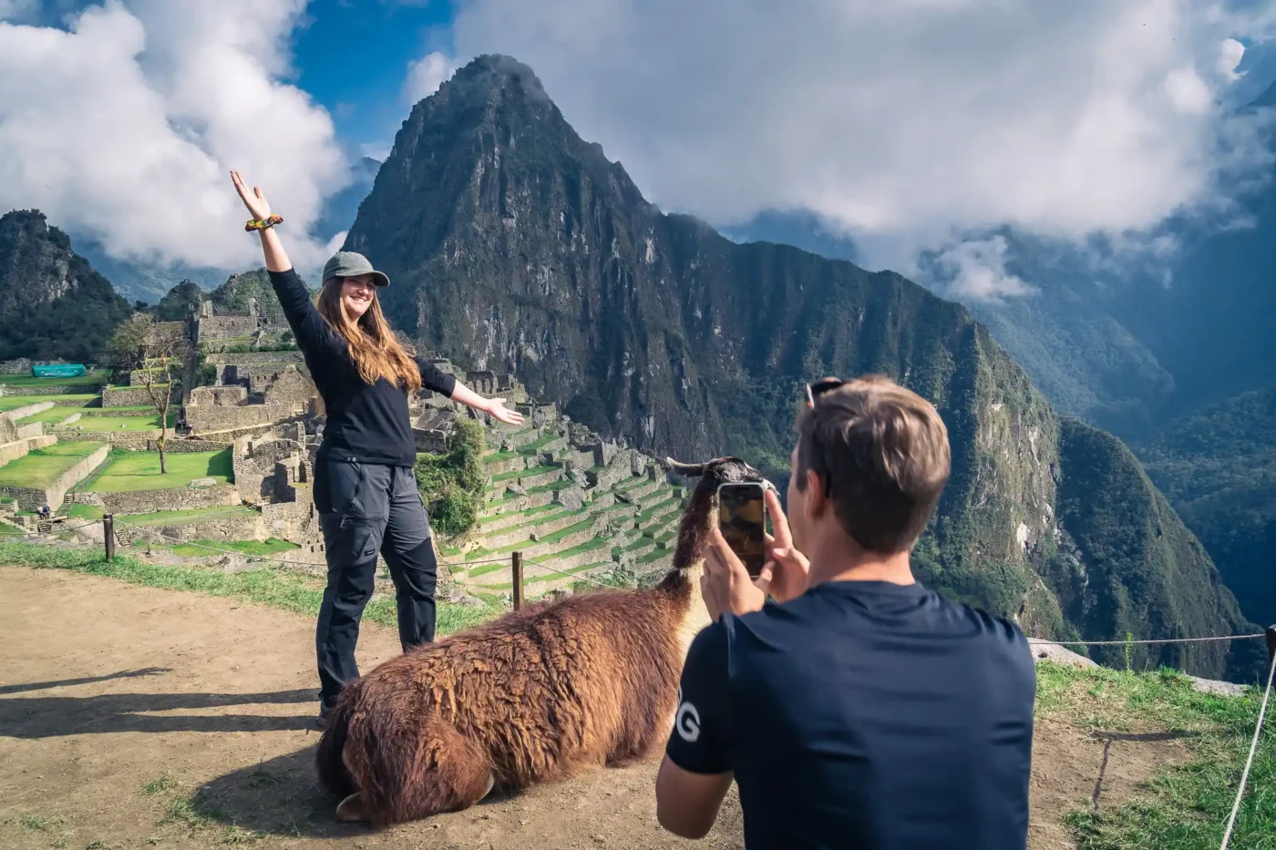 Travelers at Machu Picchu in the early morning with few people