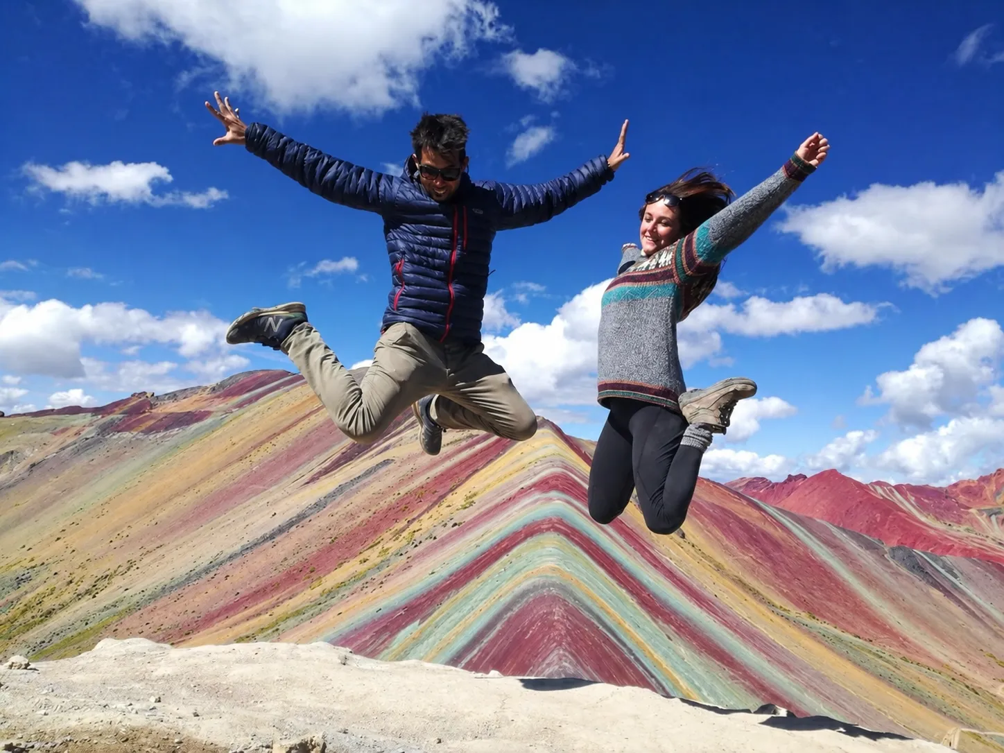 Travelers at the viewpoint of Rainbow Mountain (Vinicunca) in Cusco, Peru